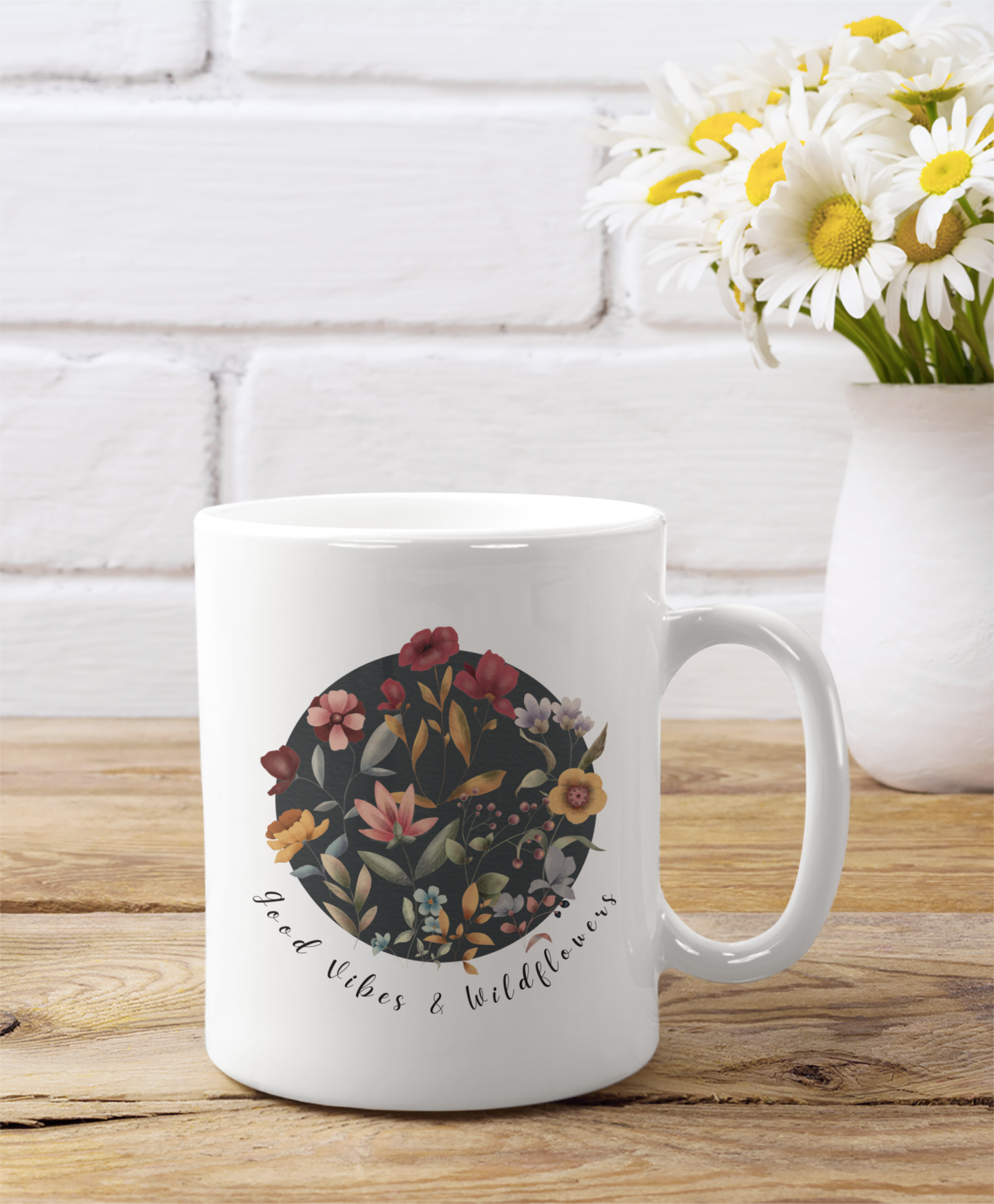 Good Vibes & Wildflowers Ceramic Mug, featuring a vibrant circle of wildflowers on a white background. Available in 11oz and 15oz sizes.