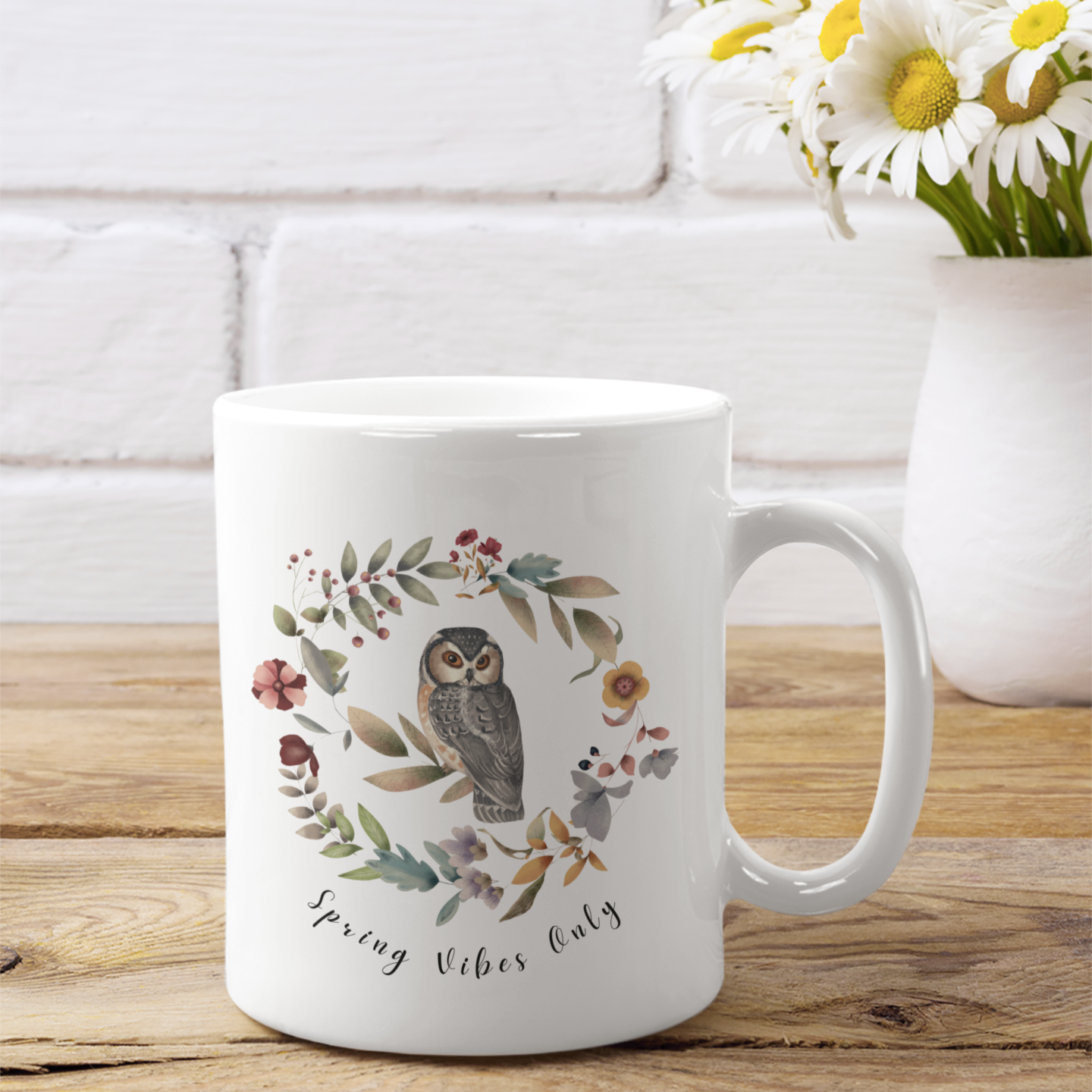 Spring Vibe Only Ceramic Mug featuring a circular design of vibrant wildflowers and owl, on a white background. Available in 11oz and 15oz sizes.