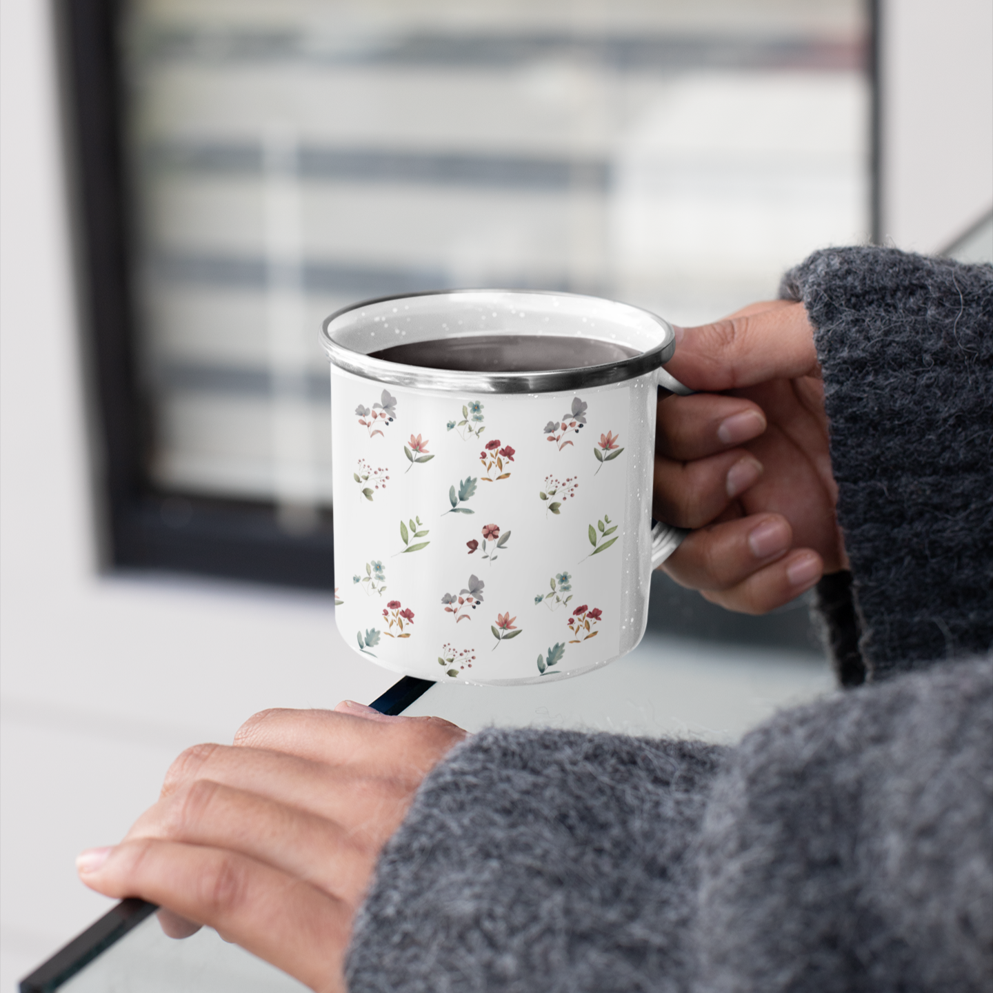 Enamel mug with a floral design