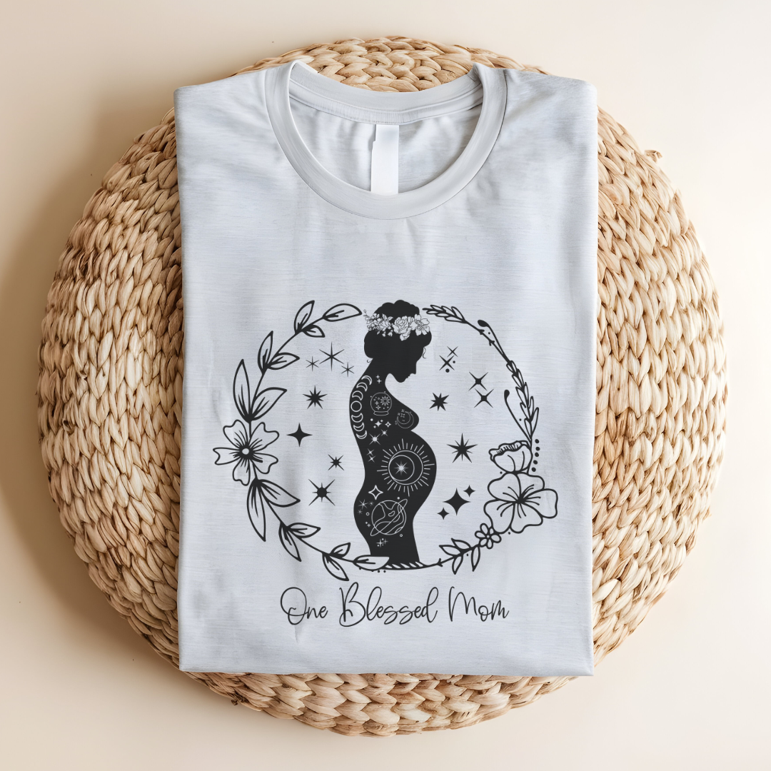Flat lay of the "One Blessed Mom" T-Shirt, highlighting the soft Airlume cotton fabric and classic crew neckline. Ash