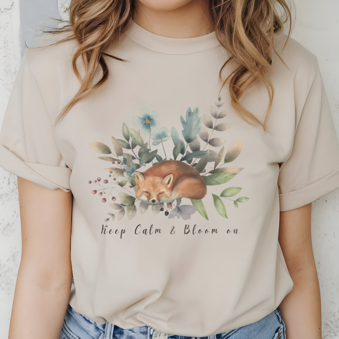 Close-up view of the "Keep Calm & Bloom On" graphic, showcasing the delicate watercolor textures of the fox's fur, the intricate details of the flower petals and leaves, and the whimsical typography of the "Keep Calm & Bloom On" text. Color Sand