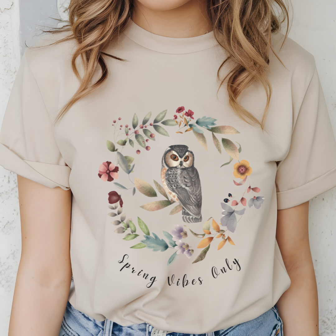 Close-up view of the "Spring Vibes Only" graphic, showcasing the delicate watercolor textures of the owl's feathers, the intricate details of the flower petals and leaves in the wreath, and the whimsical typography of the "Spring Vibes Only" text.
