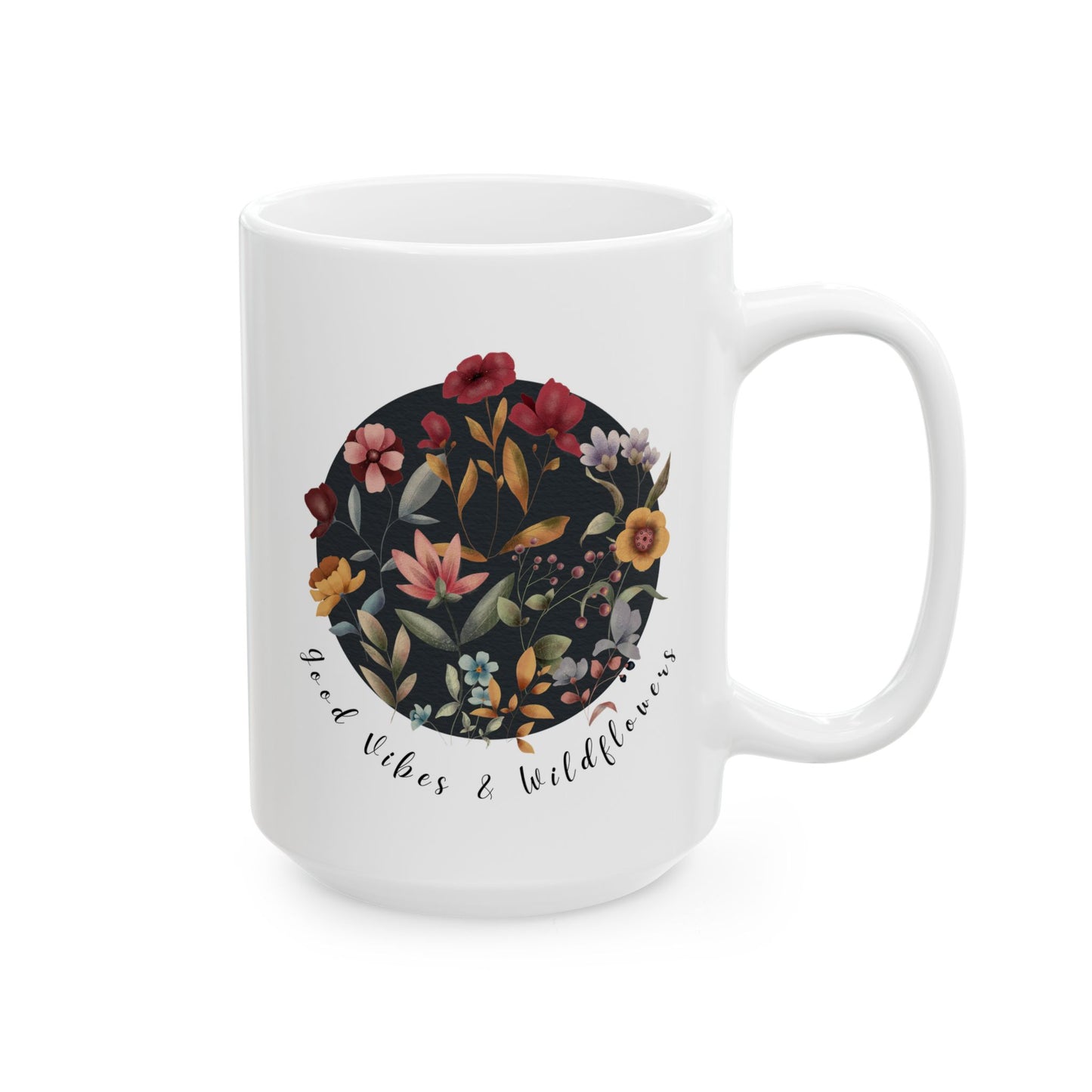 Good Vibes & Wildflowers Ceramic Mug, featuring a vibrant circle of wildflowers on a navy background. Available in 15oz