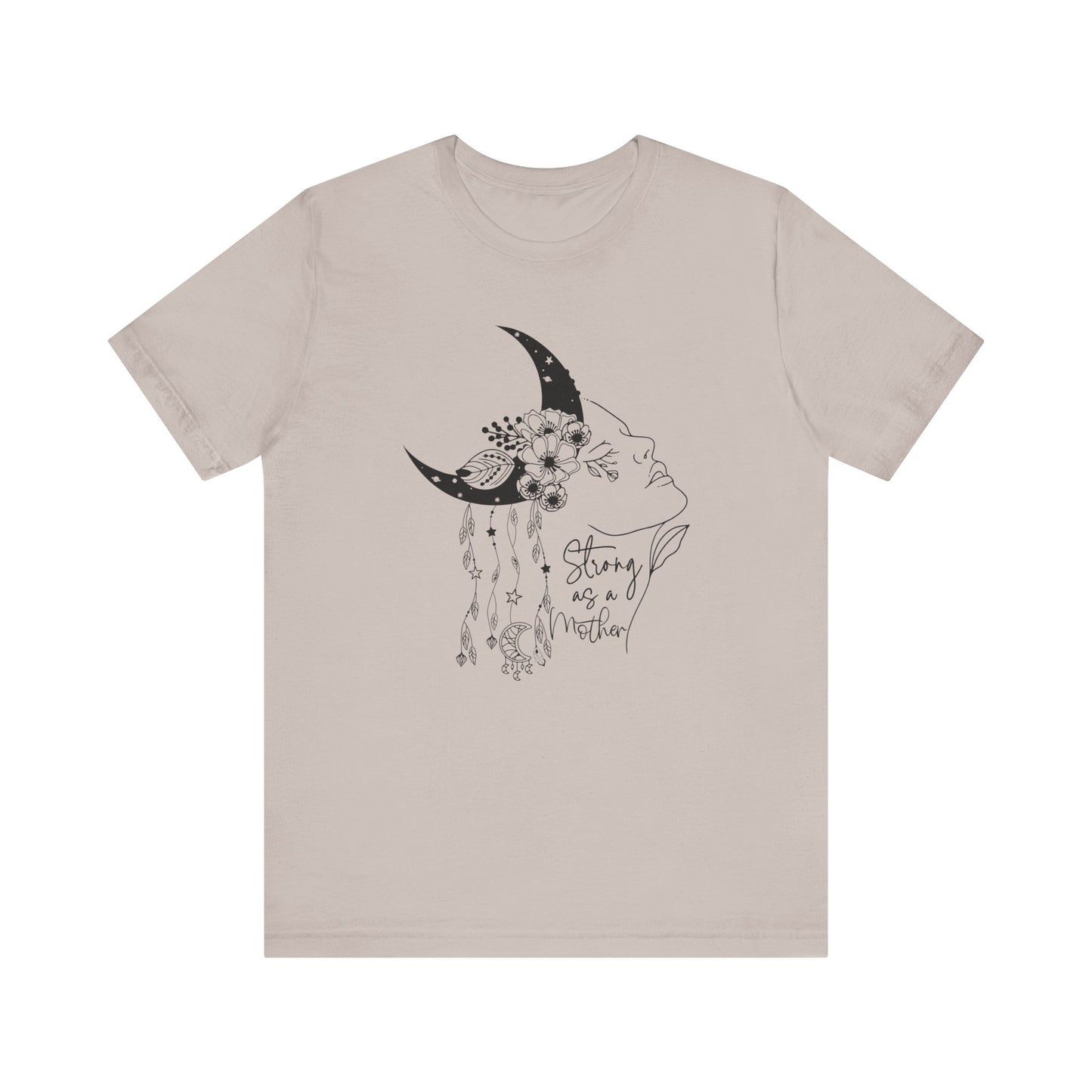 Flat lay of the "Strong as a Mother" T-Shirt, highlighting the soft Airlume cotton fabric and classic crew neckline. Color Heather Clay Gray. The graphic is clearly visible, showing the woman's profile, crescent moon, flowers, and charms in detail.