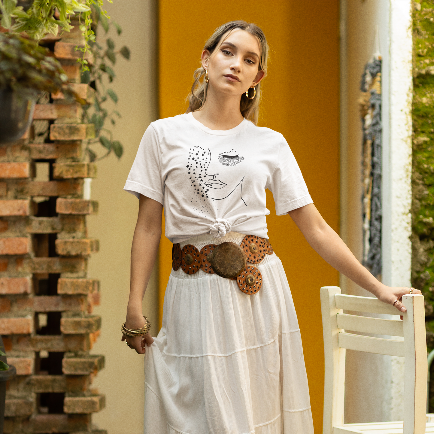 Mother Nature Unisex Jersey T-Shirt, featuring a elegant Mother Nature graphic, graphic of the silhouette of a woman's face with boho and mystical design, modeled by a woman wearing size M