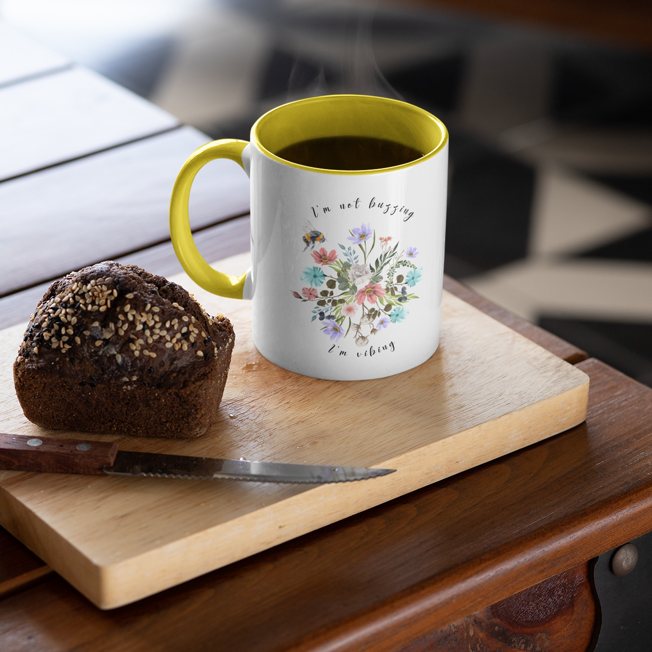 "I'm Not Buzzing, I'm Vibing" Bee & Wildflower Accent Coffee Mug, showcasing the charming bee and wildflower design on a white ceramic mug. Available in 11oz and 15oz sizes.