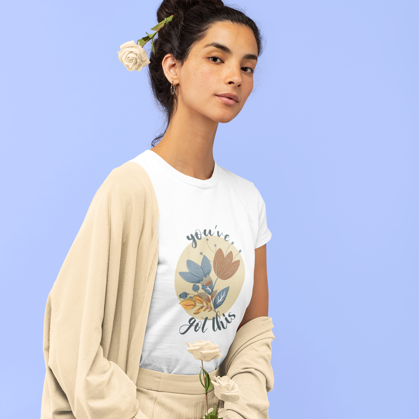 White cotton unisex t-shirt with "you've got this" motivational text and artistic floral design in blue, terracotta, and cream colors