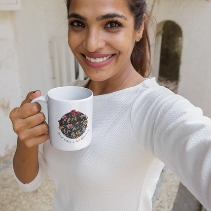  Lifestyle shot of the Good Vibes & Wildflowers Ceramic Mug filled with a warm beverage, highlighting the comfortable C-handle and the perfect size for enjoying a drink.