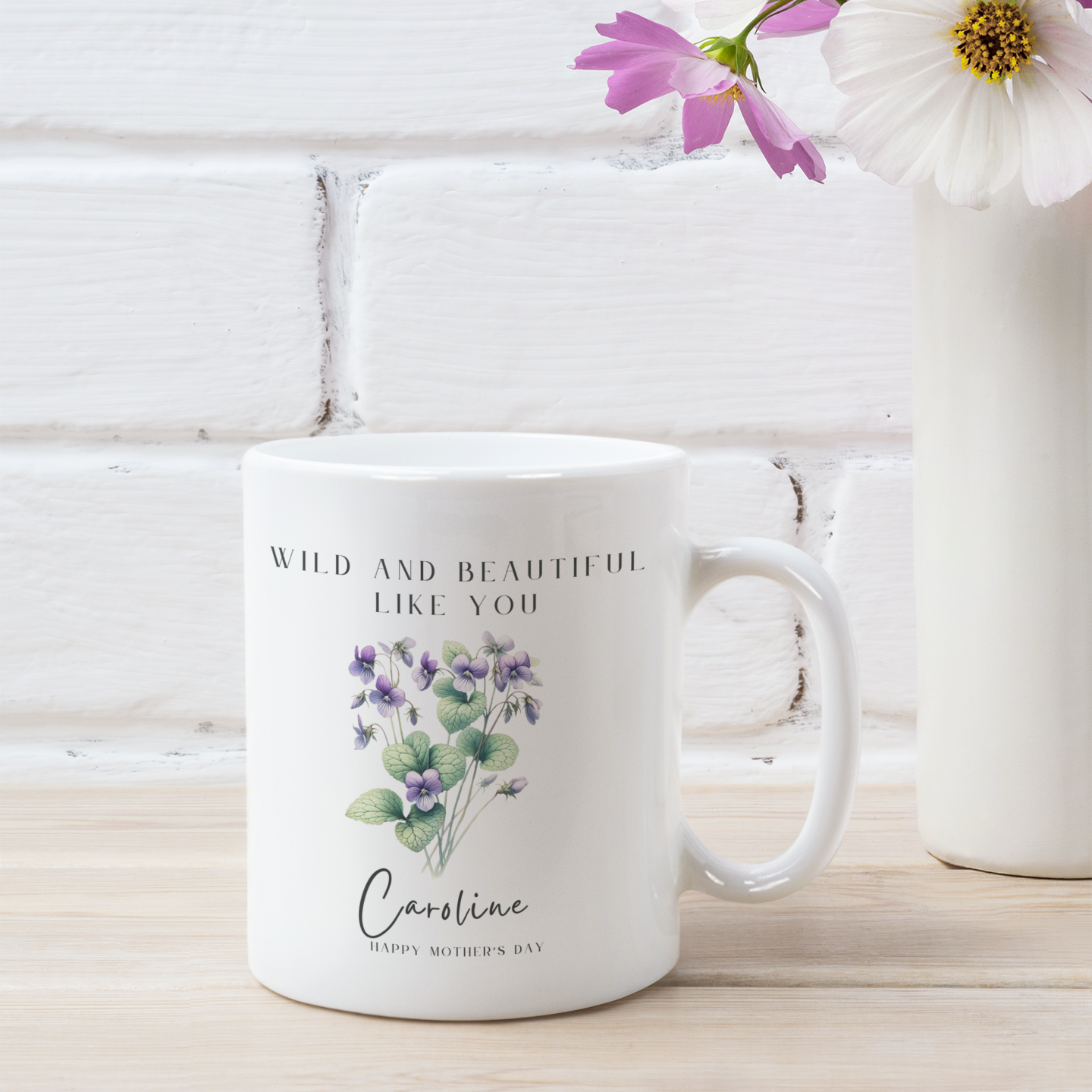 Personalized Wildflower Birth Month Mother's Day Mug, showcasing a sample design with a [Example: May - Lily of the Valley] and a personalized name and message, on a white ceramic mug. Available in 11oz and 15oz.