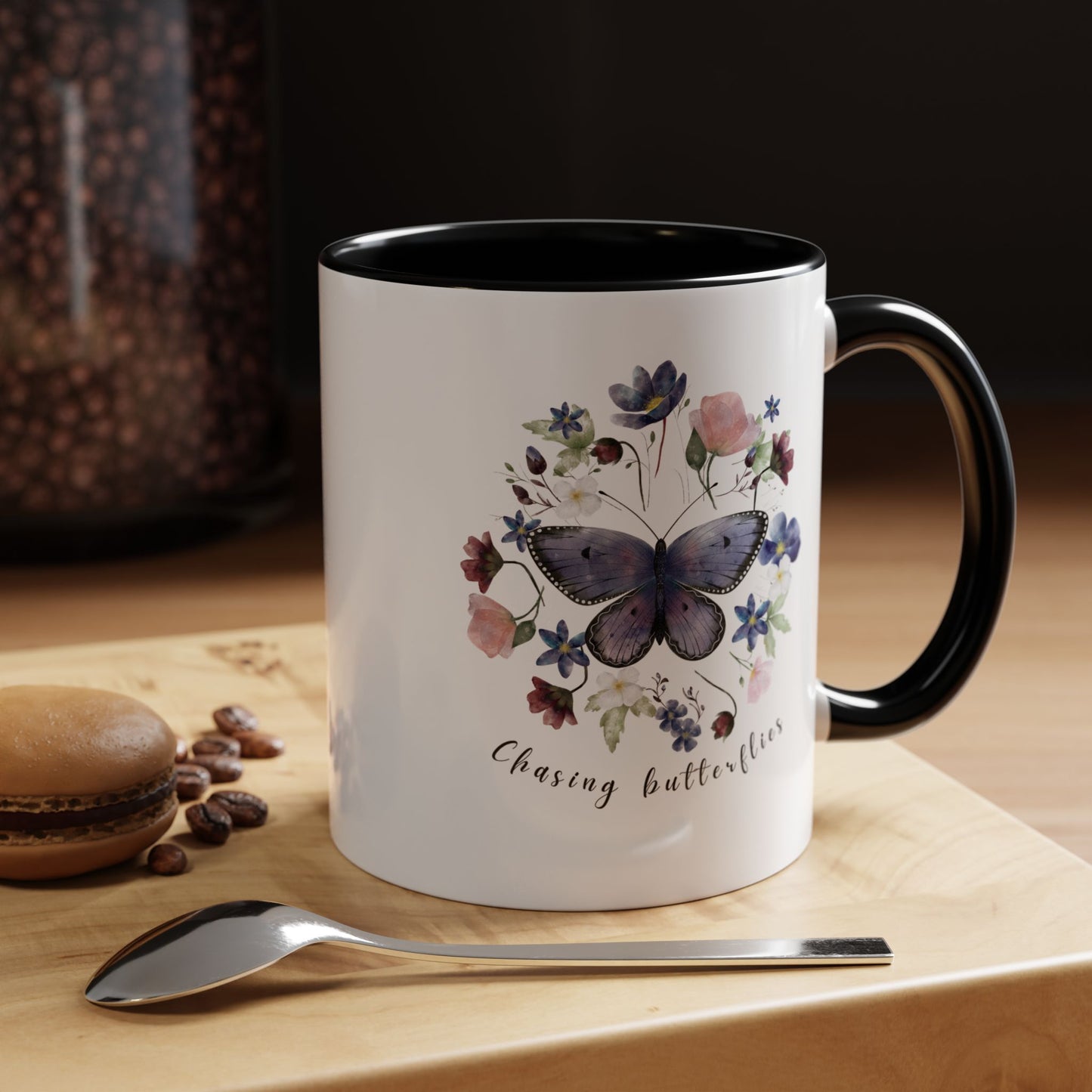 Close-up view of the intricate butterfly and wildflower design on the Butterfly & Wildflower Accent Coffee Mug, showcasing the vibrant colors and delicate details.