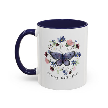 Close-up view of the intricate butterfly and wildflower design on the Butterfly & Wildflower Accent Coffee Mug, showcasing the vibrant colors and delicate details.