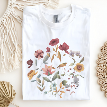 Flat lay of the "Hello Spring" Floral Tee, highlighting the soft, 100% US cotton fabric, classic crew neck, and the beautiful botanical floral design. Color White