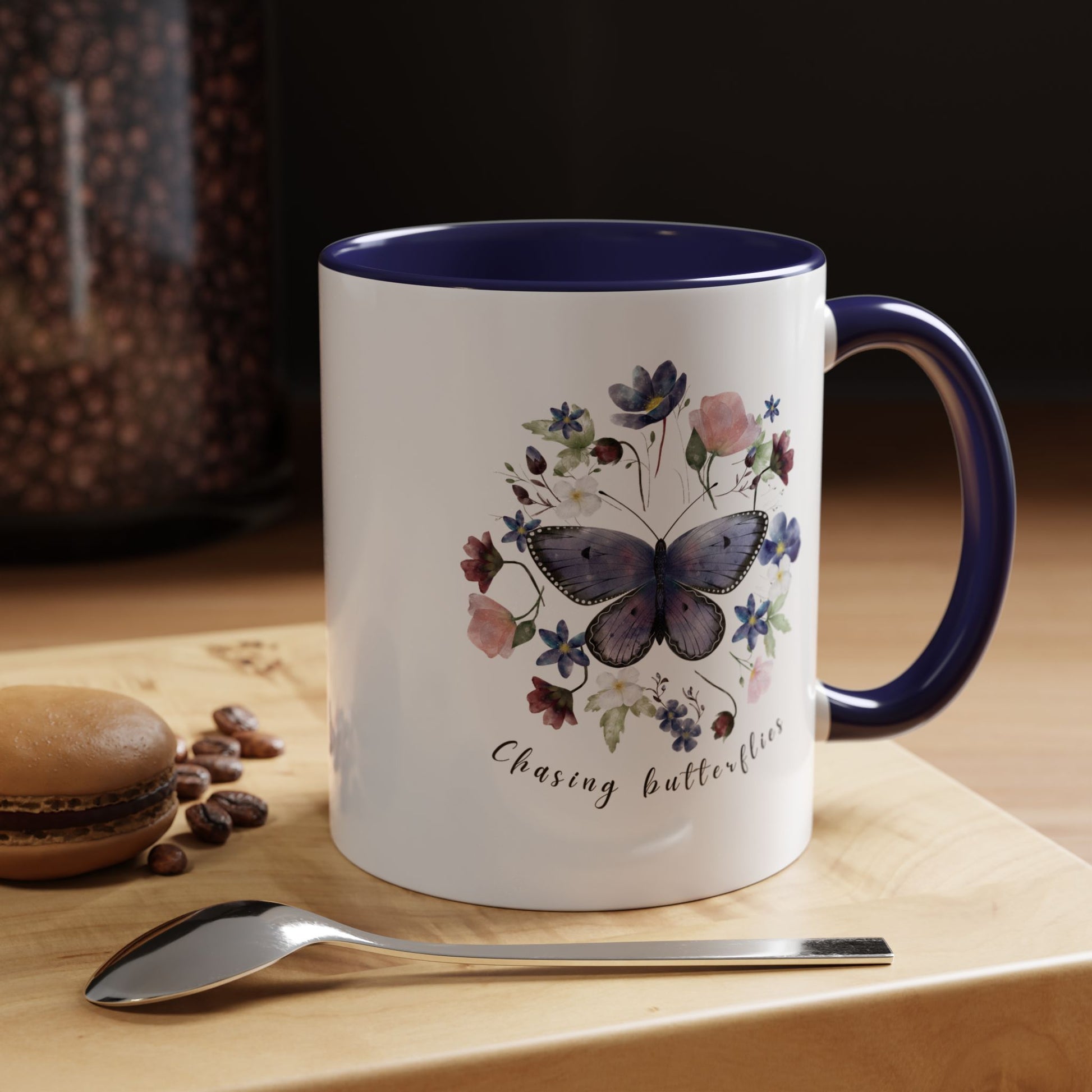 Close-up view of the intricate butterfly and wildflower design on the Butterfly & Wildflower Accent Coffee Mug, showcasing the vibrant colors and delicate details.