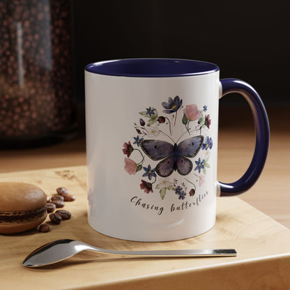 Close-up view of the intricate butterfly and wildflower design on the Butterfly & Wildflower Accent Coffee Mug, showcasing the vibrant colors and delicate details.