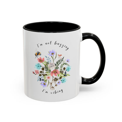 Close-up view of the detailed bee and wildflower illustration Coffee Mug,  11oz black