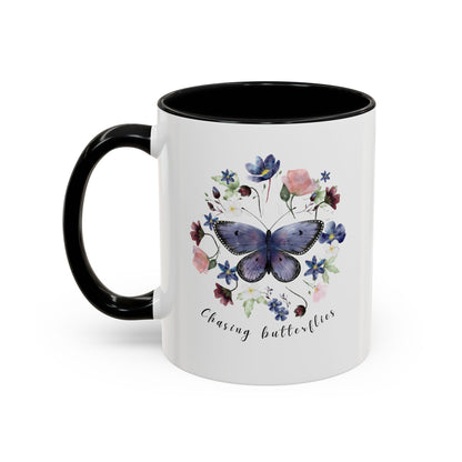 Close-up view of the intricate butterfly and wildflower design on the Butterfly & Wildflower Accent Coffee Mug, showcasing the vibrant colors and delicate details.