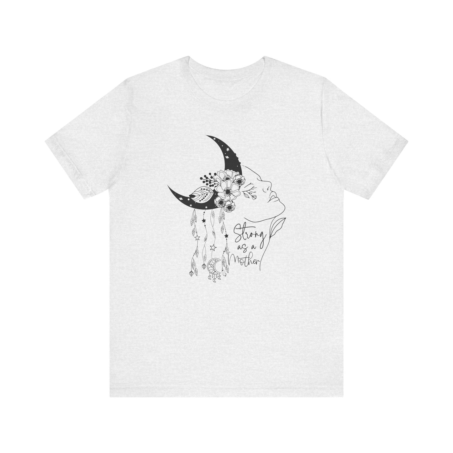 Flat lay of the "Strong as a Mother" T-Shirt, highlighting the soft Airlume cotton fabric and classic crew neckline. Color Ash. The graphic is clearly visible, showing the woman's profile, crescent moon, flowers, and charms in detail.