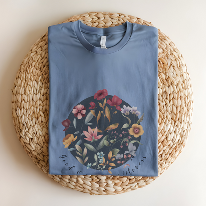 Flat lay of the "Hello Spring: Good Vibes & Wildflowers" Tee, highlighting the soft, 100% US cotton fabric, classic crew neck, and the beautiful botanical floral design. Color Heather Indigo