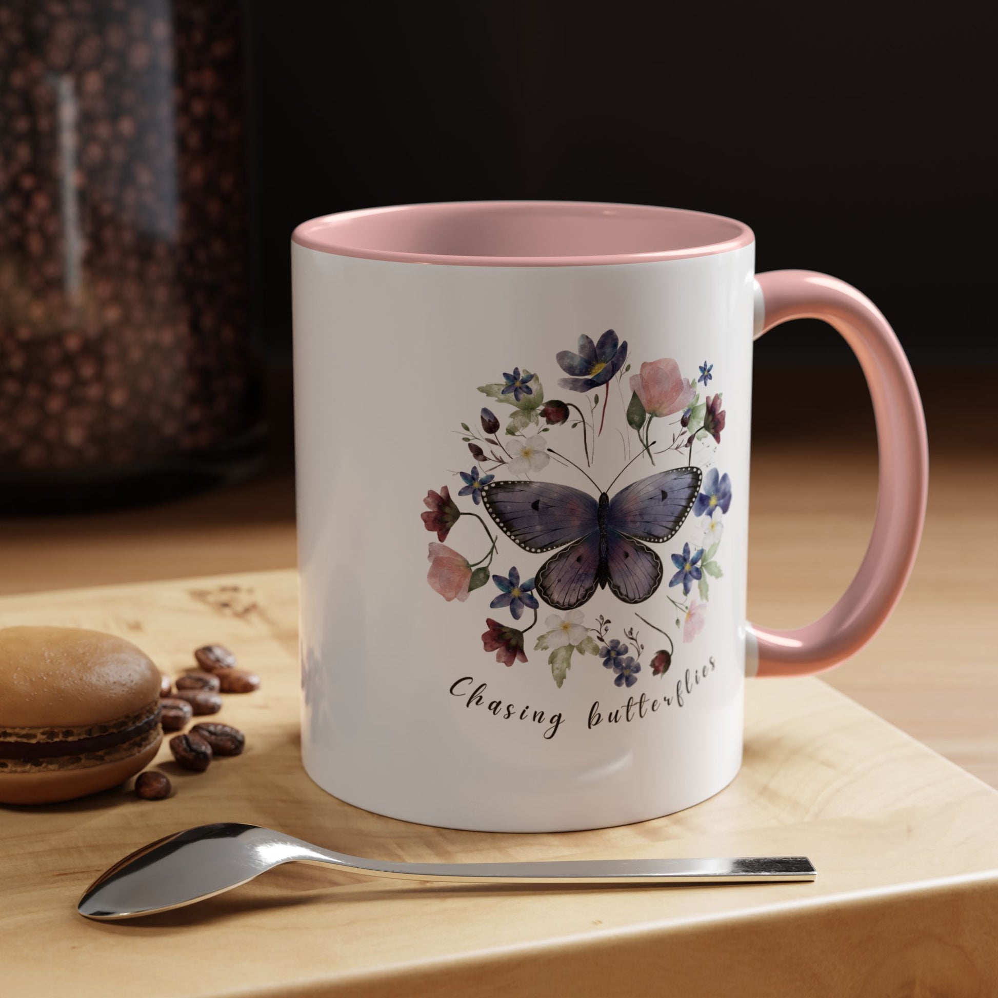 Close-up view of the intricate butterfly and wildflower design on the Butterfly & Wildflower Accent Coffee Mug, showcasing the vibrant colors and delicate details.