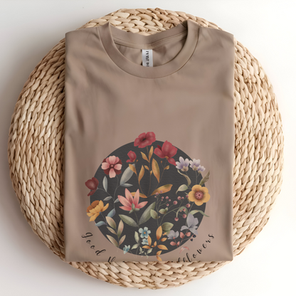 Flat lay of the "Hello Spring: Good Vibes & Wildflowers" Tee, highlighting the soft, 100% US cotton fabric, classic crew neck, and the beautiful botanical floral design. Color Tan