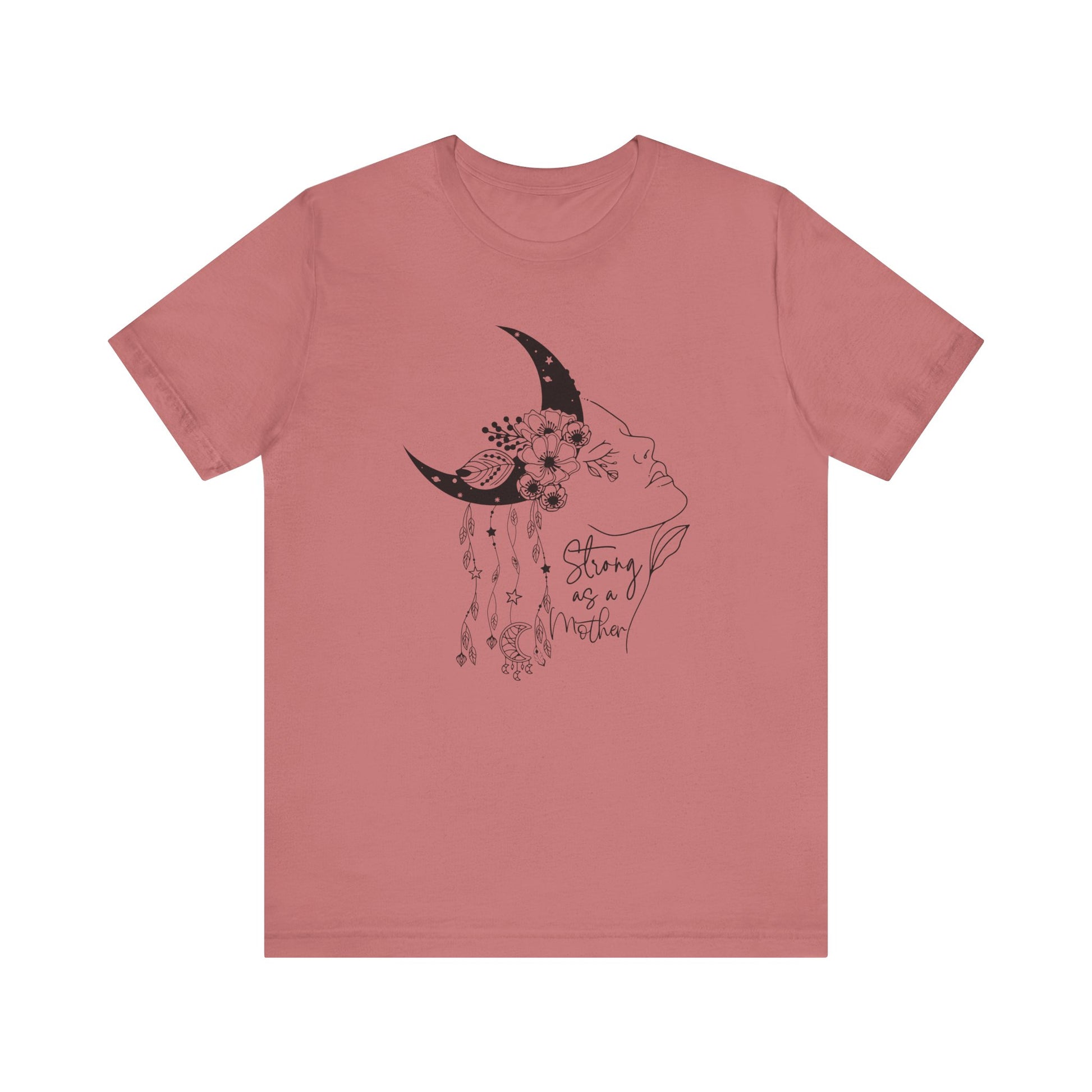 Flat lay of the "Strong as a Mother" T-Shirt, highlighting the soft Airlume cotton fabric and classic crew neckline. Color Mauve The graphic is clearly visible, showing the woman's profile, crescent moon, flowers, and charms in detail.