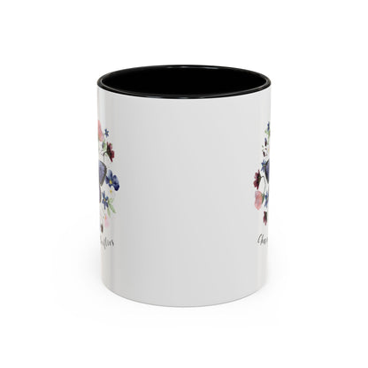 Close-up view of the intricate butterfly and wildflower design on the Butterfly & Wildflower Accent Coffee Mug, showcasing the vibrant colors and delicate details.