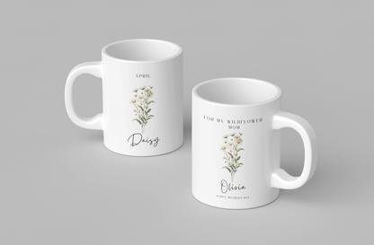 Personalized Wildflower Birth Month Mother's Day Mug, showcasing a sample design with a [April- Daisy] and a personalized name and message, on a white ceramic mug. Available in 11oz and 15oz.