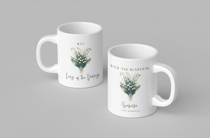 Personalized Wildflower Birth Month Mother's Day Mug, showcasing a sample design with a [May- Lily of the Valley] and a personalized name and message, on a white ceramic mug. Available in 11oz and 15oz.
