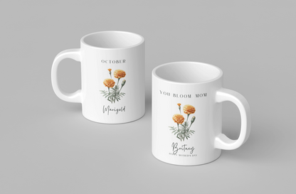 Personalized Wildflower Birth Month Mother's Day Mug, showcasing a sample design with a [October- Marigold] and a personalized name and message, on a white ceramic mug. Available in 11oz and 15oz.