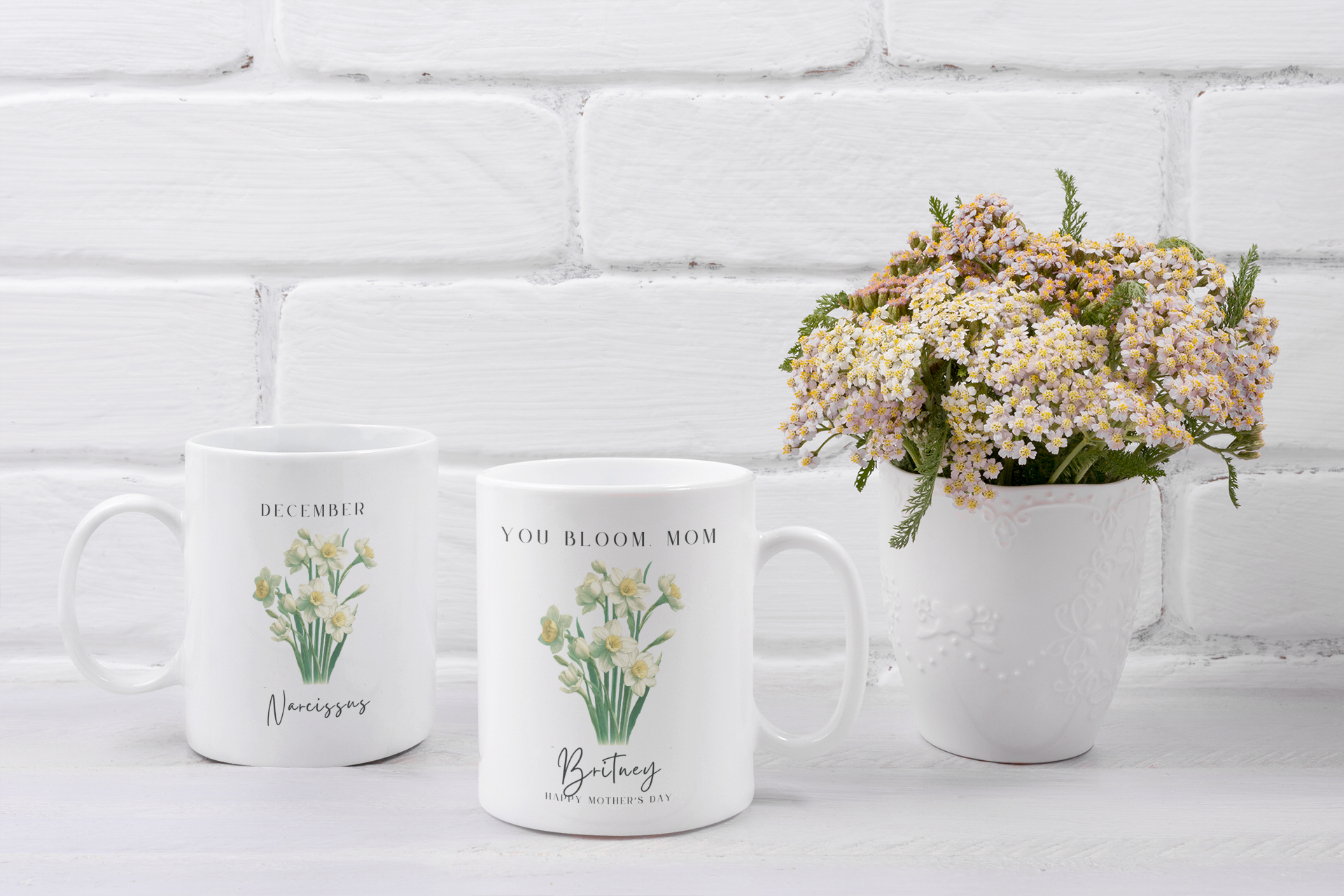 Personalized Wildflower Birth Month Mother's Day Mug, showcasing a sample design with a [December- Narcissus] and a personalized name and message, on a white ceramic mug. Available in 11oz and 15oz.