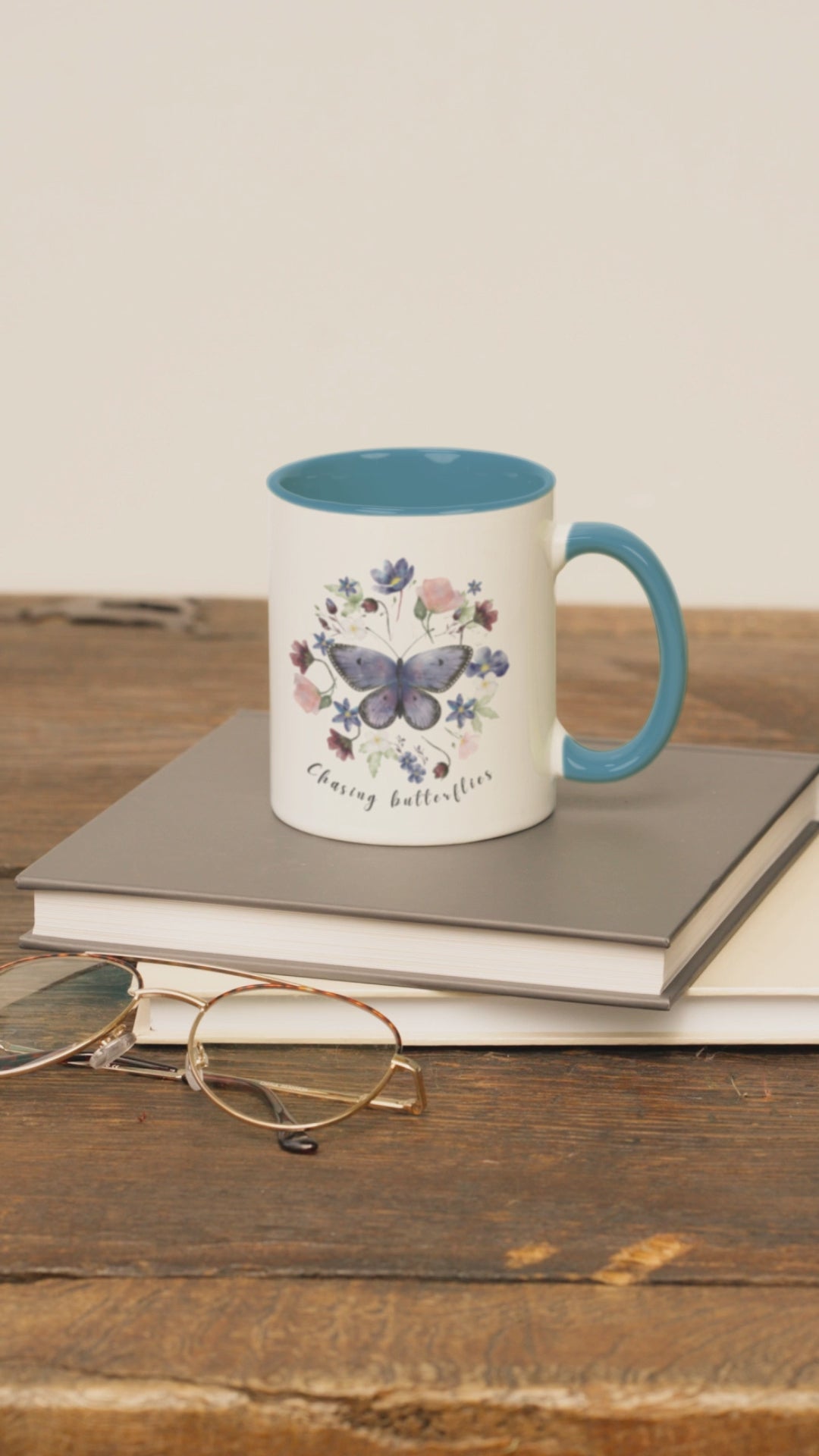  Lifestyle shot of the Butterfly & Wildflower Accent Coffee Mug filled with coffee, showing the comfortable C-shaped handle and the perfect size for enjoying your favorite beverage.