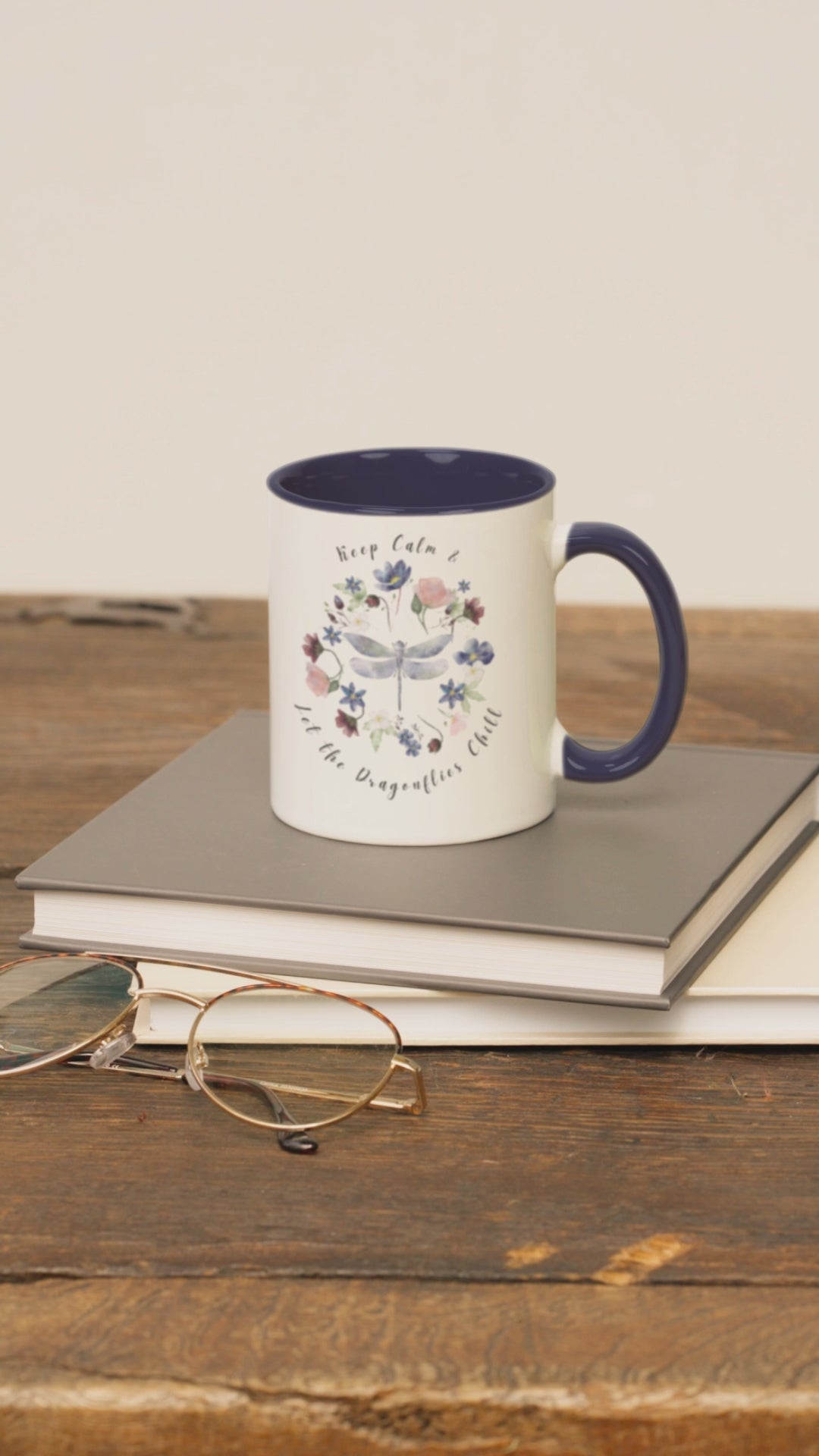 Keep Calm & Let Dragonflies Chill Coffee Mug, featuring a charming design of dragonflies and wildflowers on a white ceramic mug. Available in 11oz and 15oz.