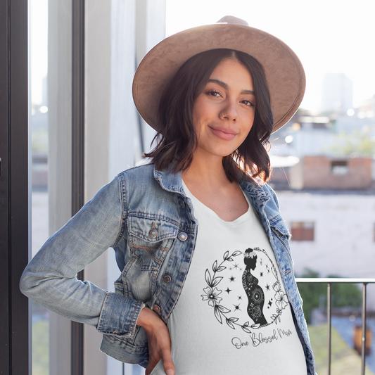 "One Blessed Mom" Unisex Jersey T-Shirt, featuring a boho-inspired design, modeled by a pregnant woman wearing size L