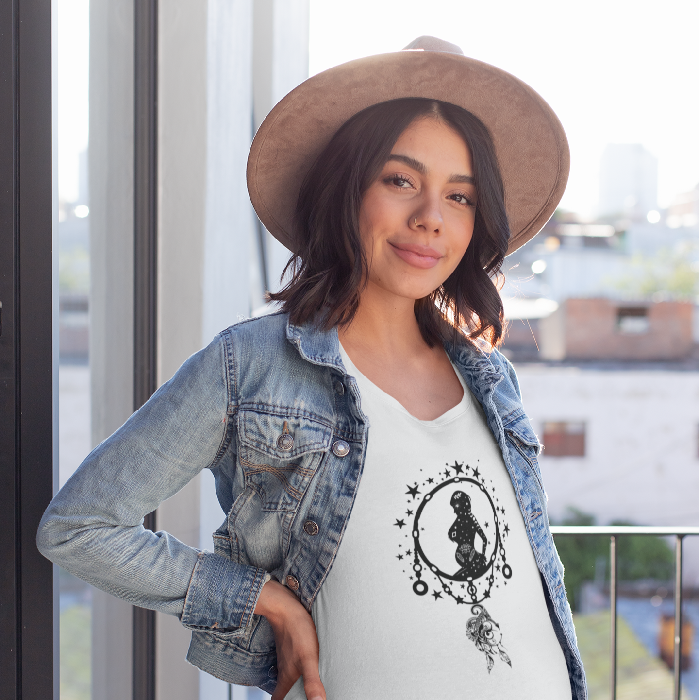 Dreamcatcher Mother's Day Unisex Jersey T-Shirt, featuring a boho dreamcatcher design, modeled by a pregnant woman wearing size [L]